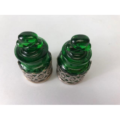 114 - Perfume bottles, pair of early 20th century green glass bottles with shamrock stoppers, in silver pl... 