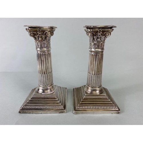 14 - Pair of Victorian Hallmarked Silver Corinthian Column candlesticks on stepped bases with beaded desi... 