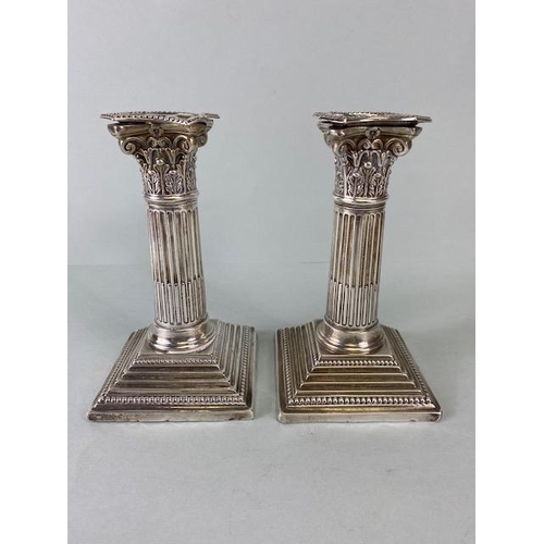 14 - Pair of Victorian Hallmarked Silver Corinthian Column candlesticks on stepped bases with beaded desi... 