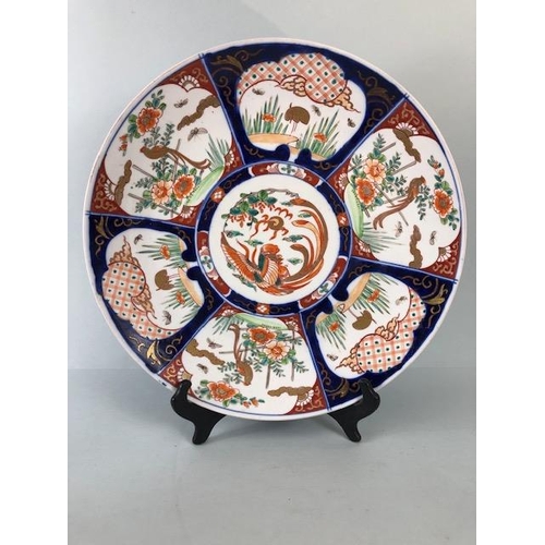 148 - Oriental ceramics, a larger Imari charger decorated with panels of birds and a phoenix to the centre... 