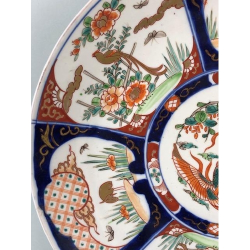 148 - Oriental ceramics, a larger Imari charger decorated with panels of birds and a phoenix to the centre... 