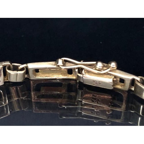 16 - 14ct Gold Bracelet in a contemporary style with good clasp and safety catch approx 18cm long and 11.... 