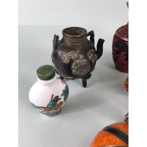 167 - Collection of oriental collectables to include Chinese snuff bottles, decorated metal tea pots, Tibe... 