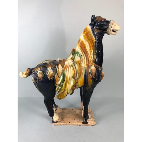 168 - Oriental Ceramics, Chinese Tang Horse of usual form decorated in dark blue glaze  with green and amb... 