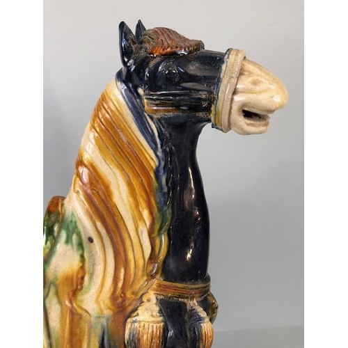 168 - Oriental Ceramics, Chinese Tang Horse of usual form decorated in dark blue glaze  with green and amb... 