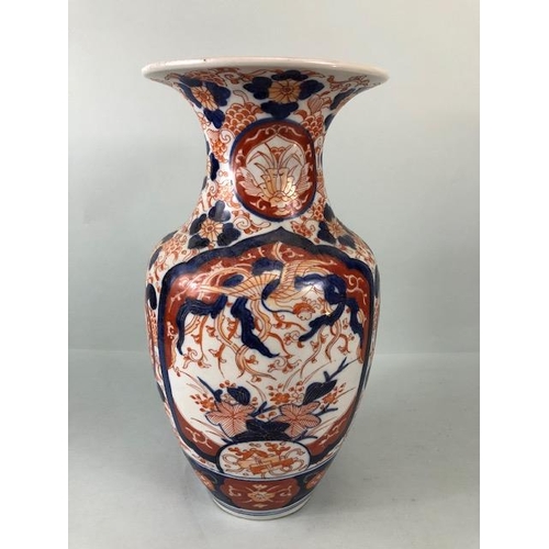 169 - Oriental ceramics, Late 18th century Japanese Imari Vase, decorated in blue and red with images of B... 