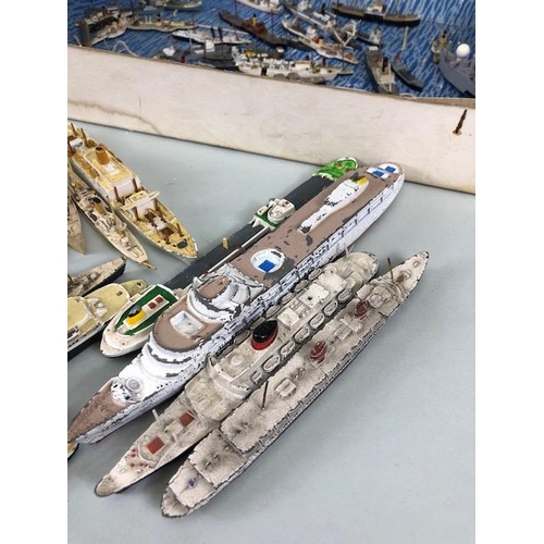 174 - Model ships, a quantity of play worn metal and plastic ship models to include Dinky, and Tri-Ang, Oc... 