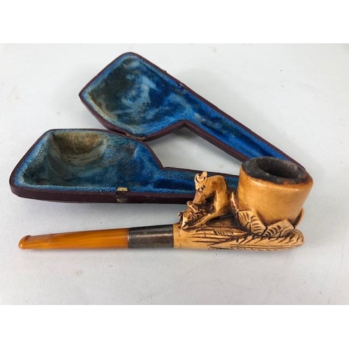 179 - Meerschaum pipes Four carved pipes all with silver metal mounts 2 with amber stems and cases