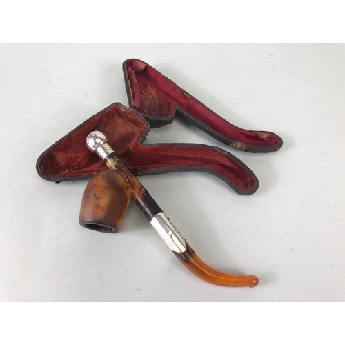 179 - Meerschaum pipes Four carved pipes all with silver metal mounts 2 with amber stems and cases