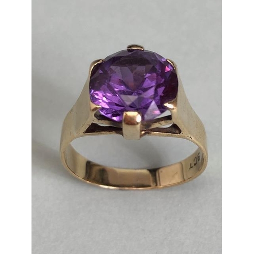 18 - 9ct Gold ring set with a Purple coloured faceted stone approx size 'M' & 3.5g