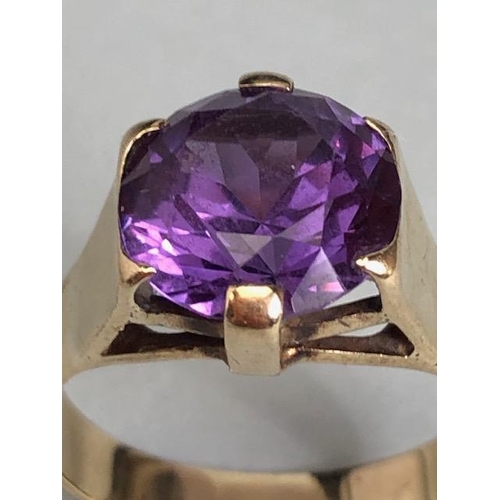 18 - 9ct Gold ring set with a Purple coloured faceted stone approx size 'M' & 3.5g