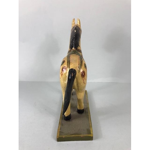 189 - Oriental carved and decorated wooden horse and two elephants, the largest approximately 24 cm high