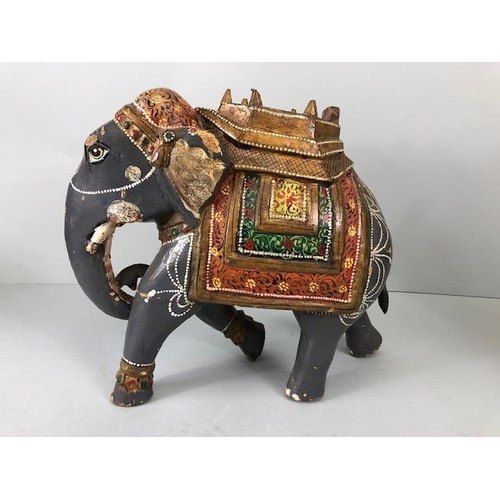 189 - Oriental carved and decorated wooden horse and two elephants, the largest approximately 24 cm high
