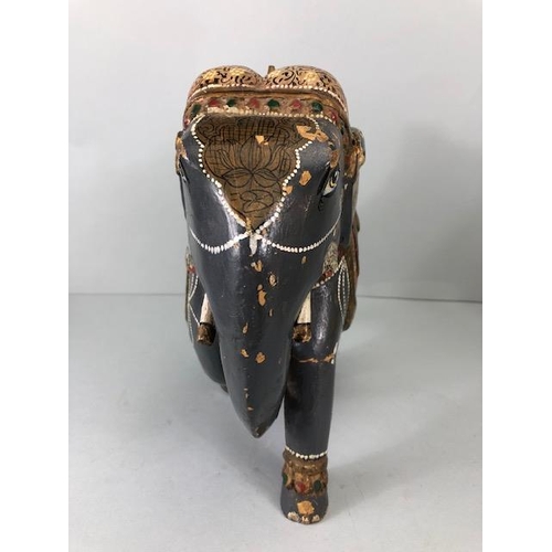189 - Oriental carved and decorated wooden horse and two elephants, the largest approximately 24 cm high
