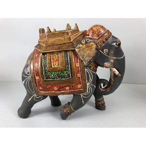 189 - Oriental carved and decorated wooden horse and two elephants, the largest approximately 24 cm high