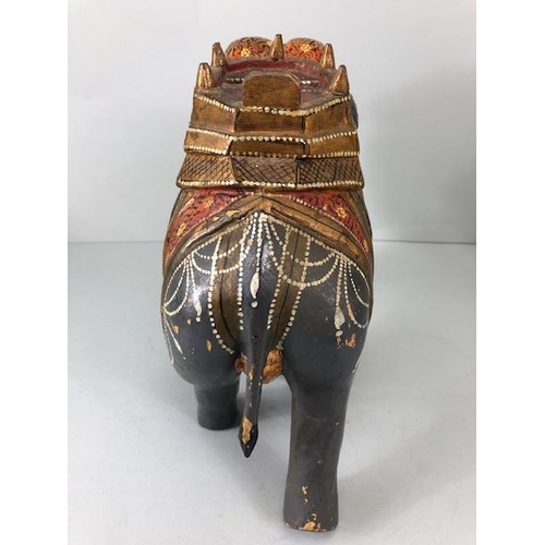 189 - Oriental carved and decorated wooden horse and two elephants, the largest approximately 24 cm high