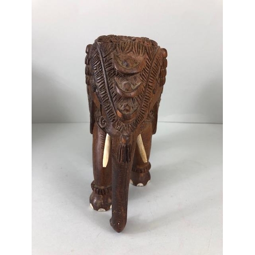 189 - Oriental carved and decorated wooden horse and two elephants, the largest approximately 24 cm high