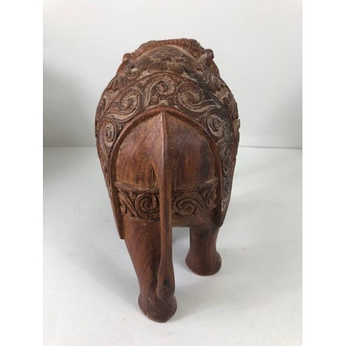189 - Oriental carved and decorated wooden horse and two elephants, the largest approximately 24 cm high