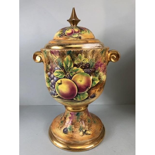 202 - Decorators interest, a Pair of Large Baroness China lidded Urns decorated with paintings of fruit an... 