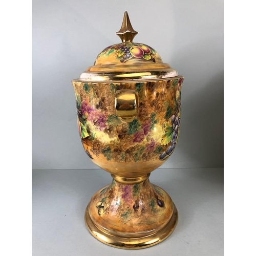 202 - Decorators interest, a Pair of Large Baroness China lidded Urns decorated with paintings of fruit an... 