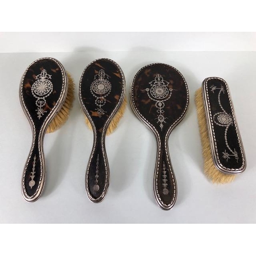 22 - Silver and Tortoise shell vanity/ dressing table brush set comprising hand held mirror and three bru... 