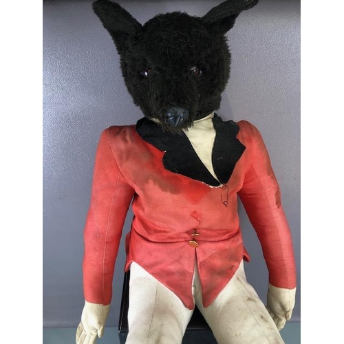 220 - Advertising Interest, Black plush seated figure of a fox dressed in hunting pinks, used in country c... 