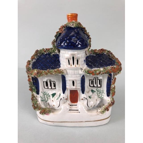 228 - Staffordshire pottery , two flat back mantel houses a Ram spill holder, and a pair of King Charles S... 