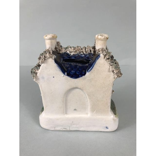 228 - Staffordshire pottery , two flat back mantel houses a Ram spill holder, and a pair of King Charles S... 