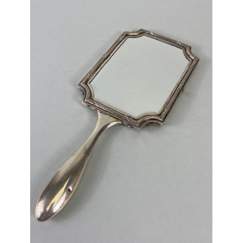 23 - Hand held Silver coloured (white metal) double sided vanity mirror with bevelled edged glass and ree... 