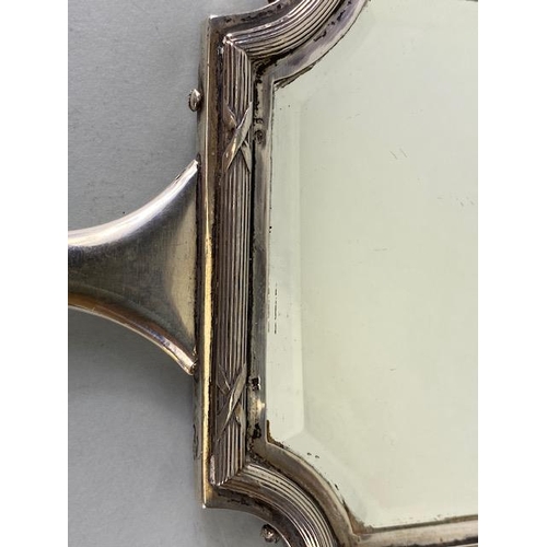 23 - Hand held Silver coloured (white metal) double sided vanity mirror with bevelled edged glass and ree... 