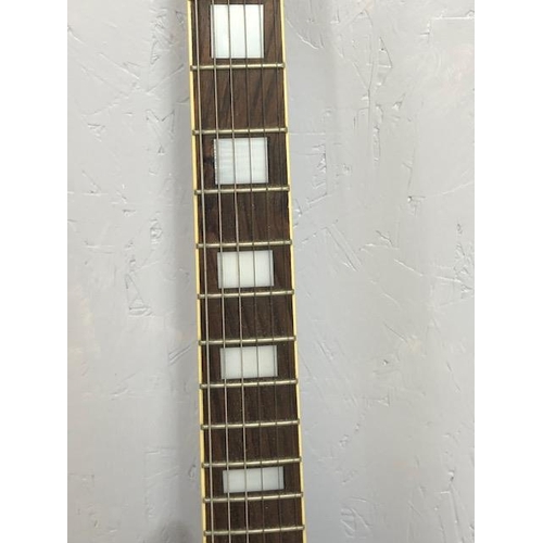 235 - Vintage Guitar. Electric Tangle wood Guitar, body with black finish, one replacement peg