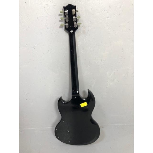 235 - Vintage Guitar. Electric Tangle wood Guitar, body with black finish, one replacement peg