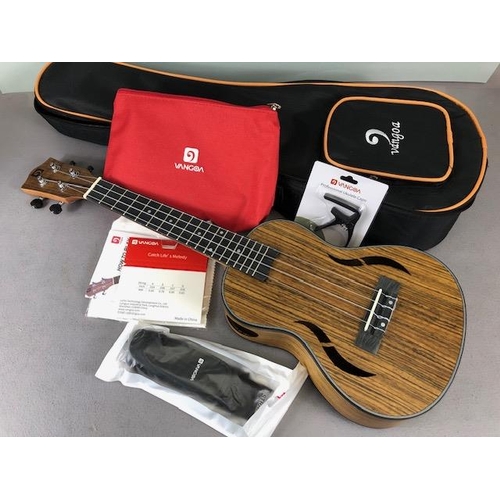 239 - Modern Ukulele, by Vango with carry case with bag of accessories , in card outer box