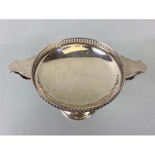 24 - Silver sweet meat dish or Tazza with twin handles and pierced edges on a stepped pedestal base Hallm... 