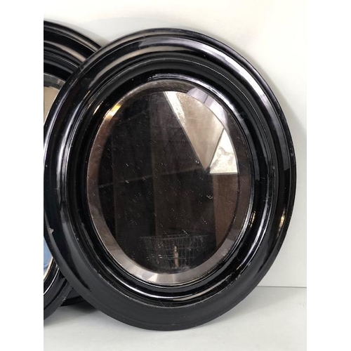 245 - Three Similar Oval Antique Black lacquered mirrors the largest approx 38cm tall