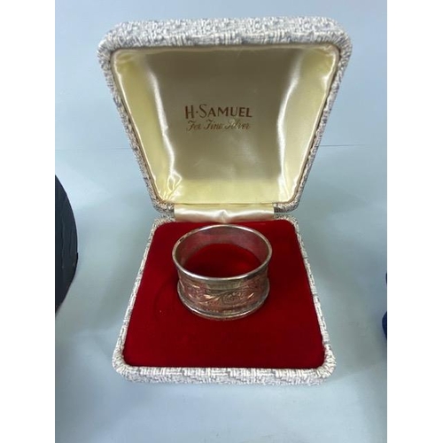 25 - Collection of four boxed Silver hallmarked various styles of napkin rings (total weight 109g)