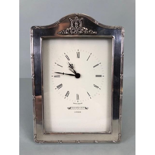 29 - Quartz Clock with cream dial Marked for Harrods of London and mounted in a silver hallmarked frame a... 