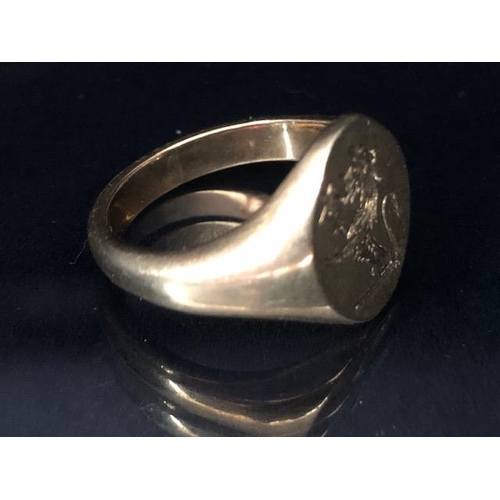 30 - 9ct Gold Signet ring engraved with a Griffin and a star size approx 'P' & 8.2g