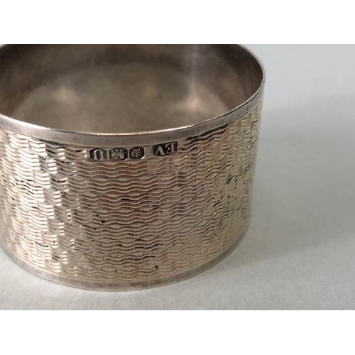 34A - Silver hallmarked lined compact and two hallmarked silver napkin rings (total weight approx60g)