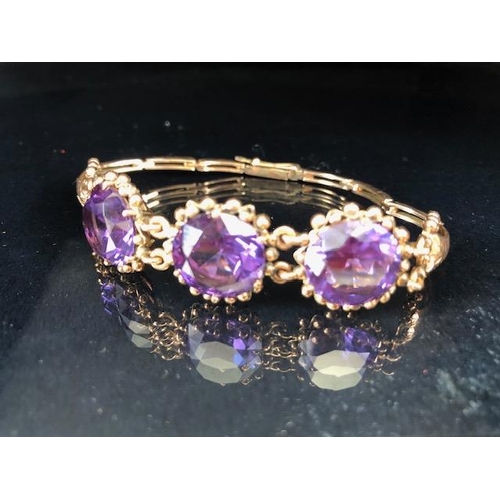 35 - 9ct Gold Bracelet set with large blue faceted stones approx 20cm in length and 25g