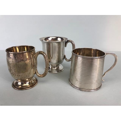 4 - Three hallmarked silver hallmarked small cups each with a handle and two on pedestal bases the large... 