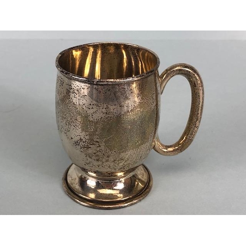 4 - Three hallmarked silver hallmarked small cups each with a handle and two on pedestal bases the large... 