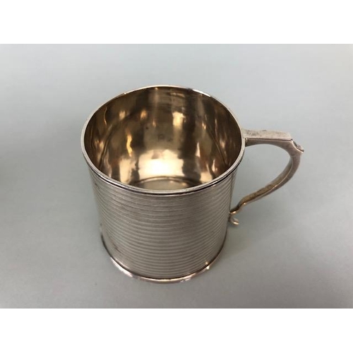 4 - Three hallmarked silver hallmarked small cups each with a handle and two on pedestal bases the large... 