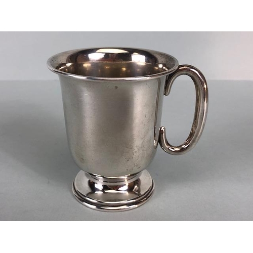 4 - Three hallmarked silver hallmarked small cups each with a handle and two on pedestal bases the large... 