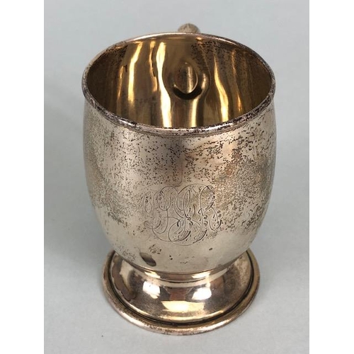 4 - Three hallmarked silver hallmarked small cups each with a handle and two on pedestal bases the large... 