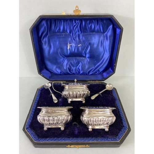 46 - Silver Hallmarked Salts with Blue glass liners and a lidded mustard pot in presentation bod with spo... 