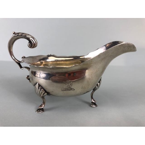 5 - Silver hallmarked sauce boat on three splayed legs hallmarked for Birmingham by maker Thomas Hayes e... 