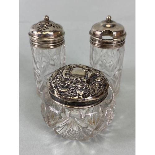 50 - Collection of eight glass and hallmarked silver lidded jars and bottles