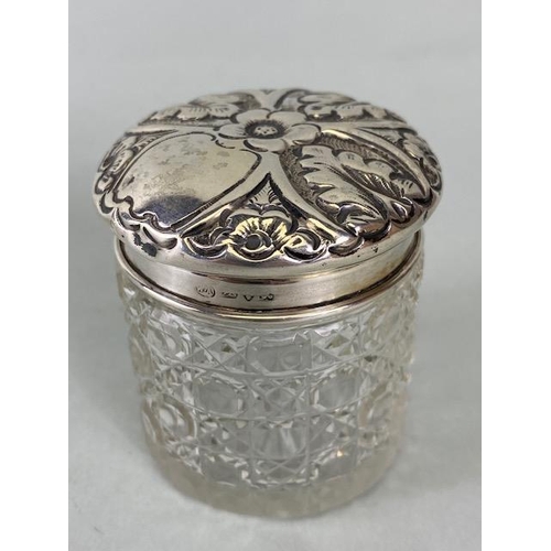 50 - Collection of eight glass and hallmarked silver lidded jars and bottles