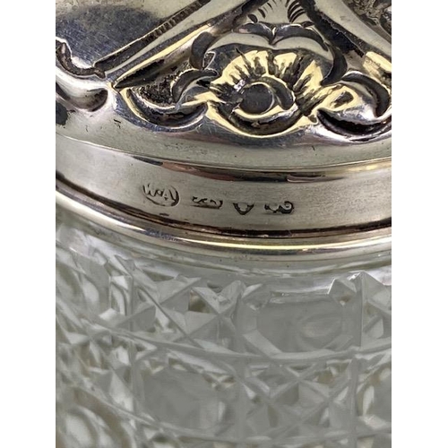 50 - Collection of eight glass and hallmarked silver lidded jars and bottles